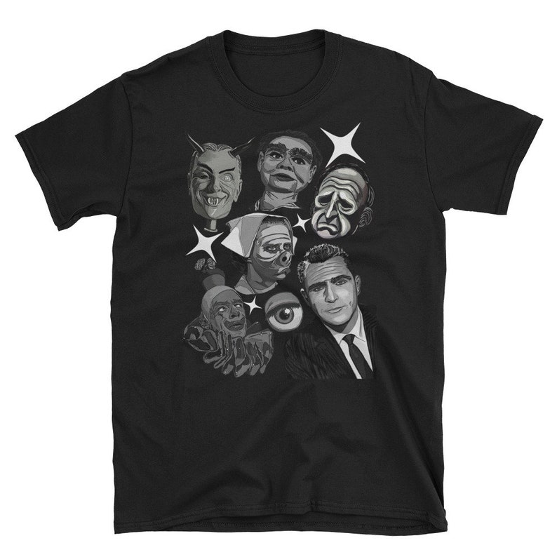 May include: Black t-shirt featuring a grayscale graphic of various vintage horror and sci-fi characters, including a devil, a ventriloquist dummy, and a man in a suit. White starbursts accent the design. A unique tee for fans of classic monster movies.