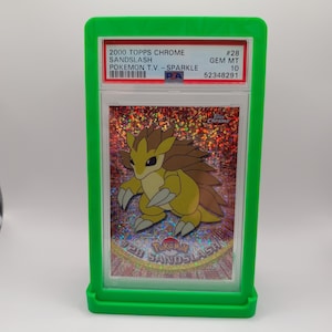 May include: A graded Pokemon trading card featuring Sandslash from the 2000 Topps Chrome Pokemon T.V. - Sparkle series. The card is graded Gem Mint 10 and has a PSA number of 52348291.