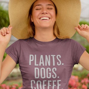 Plants Dogs Coffee Shirt | Minimalist Block Text T-Shirt | Bold Plant Dog Coffee Tee | Gift for Plant Moms & Dog Lovers | Outer Aisle Attire