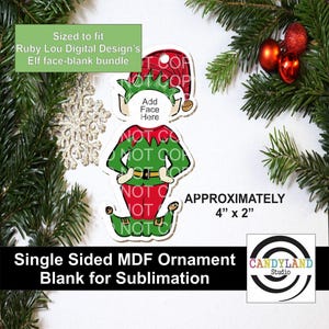 May include: A single-sided MDF ornament blank for sublimation, shaped like an elf. The elf is wearing a red and green outfit with a gold belt. The ornament is approximately 4" x 2" and includes the text "Add Face Here".