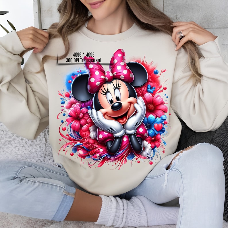 May include: A beige sweatshirt with a colorful graphic print of Minnie Mouse surrounded by flowers. The graphic includes red, pink, white, and blue colors. The text "4096 * 4096 300 DPI Transparent" is printed on the sweatshirt.