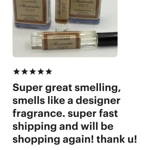 May include: A selection of perfume bottles and a rollerball. The clear bottles have black caps and labels reading "Layers of Illusions Marshmallow Puff." The rollerball also has this label. The fragrance is described as smelling great.