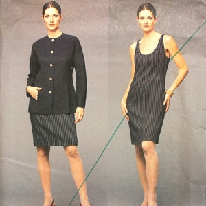 May include: A sewing pattern for a black and white striped dress and a black jacket. The pattern is by Geoffrey Beene, a Vogue American Designer. The pattern number is 2573.