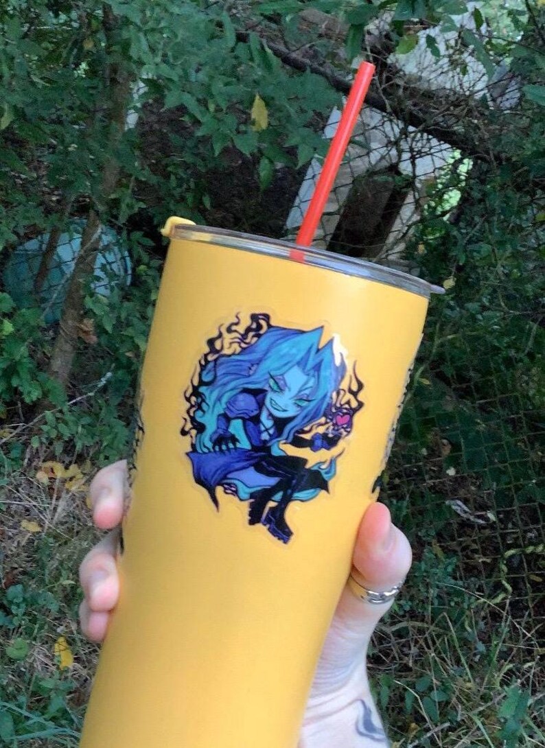 May include: A yellow stainless steel tumbler with a blue and purple anime character sticker. The character is holding a heart-shaped object. The tumbler has a red straw.