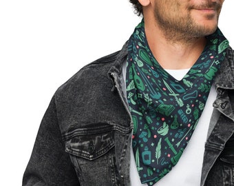 May include: A man wearing a black denim jacket over a white t-shirt. He is wearing a green and blue bandana with a pattern of camping and outdoor gear.