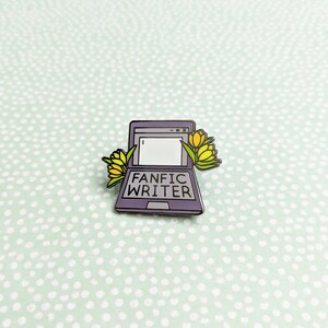 May include: A purple laptop computer with the text "Fanfic Writer" on the screen. The laptop is decorated with yellow flowers.