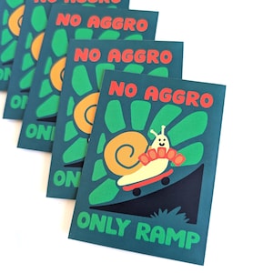 May include: A stack of teal cards with the words "NO AGGRO" in red and "ONLY RAMP" in green. Each card features a cartoon snail on a skateboard, with a yellow sun and green background.