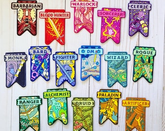 May include: A set of 16 colourful embroidered patches featuring different Dungeons and Dragons character classes. Each patch is shaped like a banner with a unique design and text. The classes include Barbarian, Warlock, Cleric, Blood Hunter, Sorcerer, Bard, DM, Rogue, Monk, Fighter, Wizard, Alchemist, Paladin, Ranger, Druid, and Artificer.