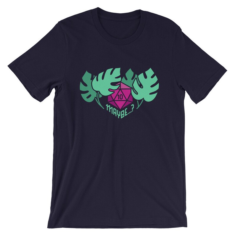 Puede incluir: Camiseta azul marino con un gr&aacute;fico de dados verde y rosa y el texto "MAYBE...?" rodeado de hojas tropicales verdes.