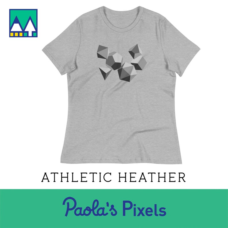 May include: A heather gray women's t-shirt with a graphic of geometric shapes in shades of gray. The text "Paola's Pixels" is printed below the graphic.