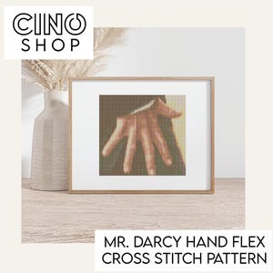 May include: A cross stitch pattern of a hand, titled "Mr. Darcy Hand Flex Cross Stitch Pattern".