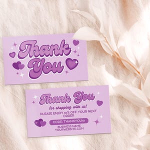 May include: Two purple thank you cards with a retro font and hearts. The top card says "Thank You" and the bottom card says "Thank You" with the text "for shopping with us! Please enjoy 10% off your next order. Code: THANKYOU10. Business Name. Yourwebsite.com."