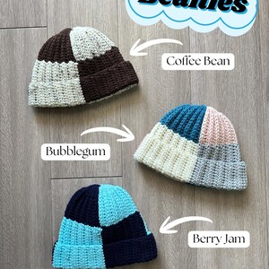 May include: Three handmade, checkered beanies in the colors Coffee Bean, Bubblegum, and Berry Jam. The beanies are made of a chunky knit material and feature a folded brim. The text "Checkered Beanies" is in a blue cloud.