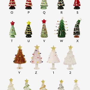 May include: A collection of 30 glass Christmas tree decorations in various colours and designs, including clear, green, red, white, blue, and gold. Each decoration features a star on top and a variety of embellishments, such as glitter, beads, and ribbons.