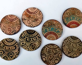 May include: Seven round leather coasters with intricate mandala designs in shades of brown, beige, orange, and blue.