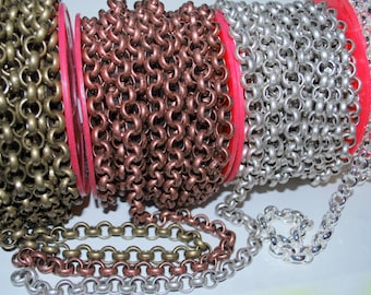 May include: Three spools of chain, one in antique brass, one in copper, and one in silver. The chain is linked together in a cable style.