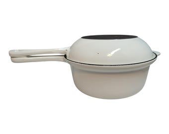 Le Creuset 2 In 1 Multifunction Sauce Pan Skillet in White color. Has light wear and some surface scratches from age and usage