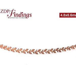 May include: A copper-colored metal trim with a leaf design. The trim is 4.8 inches long and 0.6 inches wide.