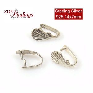 May include: Two silver-toned shell-shaped pendant bails with a loop opening. Sterling Silver 925 14x7mm.