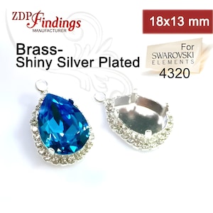 2 sztuki łezkowatych zawieszek z oprawą w kolorze srebrnym, 18 x 13 mm, z kryształkami. Pasuje do kaboszonów i kryształków Swarovski Pear 4320 (PR1813PVCRYSP)