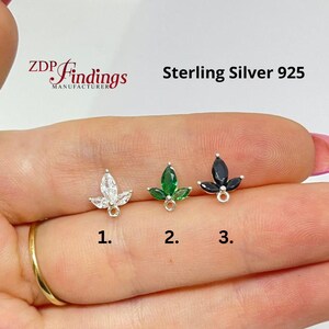 Puede incluir: Tres pendientes de plata de ley con forma de hoja con piedras preciosas de diferentes colores: transparente, verde y negro. Los pendientes están numerados 1, 2 y 3. El texto "Sterling Silver 925" es visible. El logotipo de la marca "ZDP Findings" también es visible.