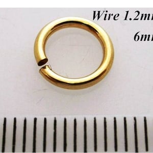 May include: A gold jump ring with a 6 mm diameter and 1.2 mm wire thickness.