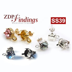 May include: Two pairs of earring settings with a silver and gold finish. The settings are designed to hold a round stone. The settings have a loop on the side for attaching a chain or other jewelry. The image also includes the text "SS39".