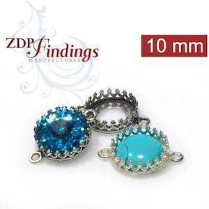 May include: Three silver-toned metal crown-shaped settings for 10 mm gemstones. The settings have two loops on the side for attaching to jewellery. One setting has a blue gemstone, one has a turquoise gemstone, and one is empty.