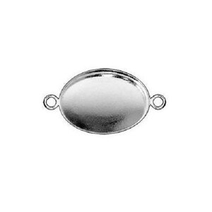 May include: Silver oval pendant with two loops on the sides. The pendant is designed to hold a cameo or other decorative element.