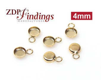 May include: Six gold-toned metal 4mm bezel cup settings with loops.  ZDP Findings Manufacturer.
