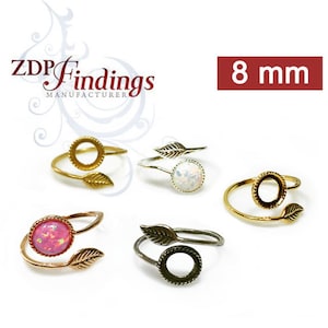 May include: Four adjustable rings with a leaf design and a 8 mm bezel setting. The rings are available in gold, silver, and black.