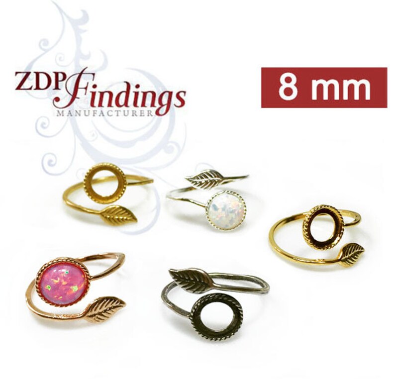 May include: Four adjustable rings with a leaf design and a 8 mm bezel setting. The rings are available in gold, silver, and black.