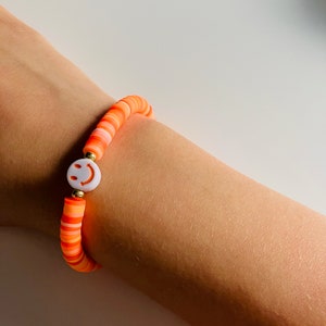 Orange smiley face bracelet