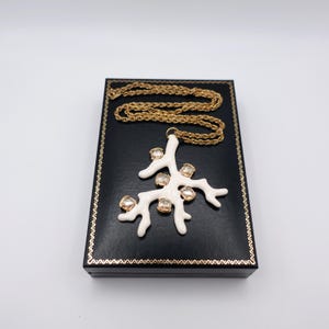 Signed KJL White Coral Pendant Necklace by Kenneth Jay Lane with Enamel on Gold Tone Metal - Statement Piece - on top of box