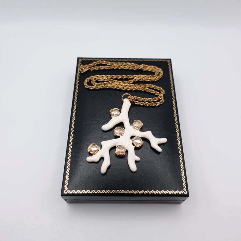 Signed KJL White Coral Pendant Necklace by Kenneth Jay Lane with Enamel on Gold Tone Metal - Statement Piece - on top of box