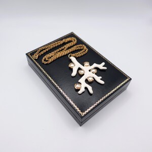 Signed KJL White Coral Pendant Necklace by Kenneth Jay Lane with Enamel on Gold Tone Metal - Statement Piece - turned to the left