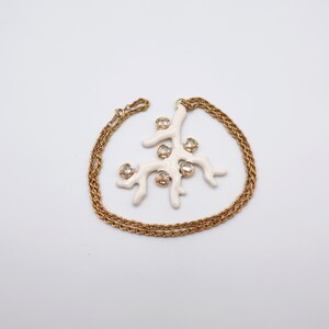 Signed KJL White Coral Pendant Necklace by Kenneth Jay Lane with Enamel on Gold Tone Metal - Statement Piece - necklace wrapped around pendant, no box