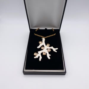 Signed KJL White Coral Pendant Necklace by Kenneth Jay Lane with Enamel on Gold Tone Metal - Statement Piece - overview of pendant in box