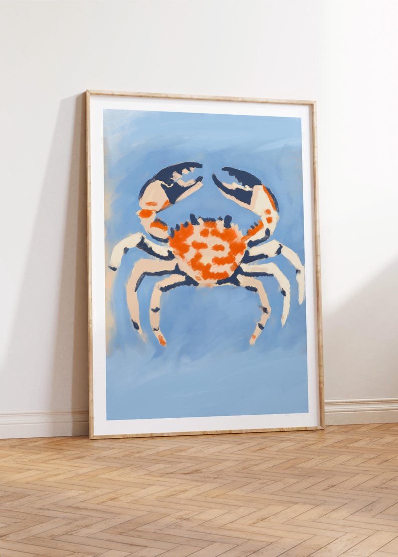 May include: A framed illustration of a crab on a light blue background. The crab is painted in shades of orange, white, and blue.