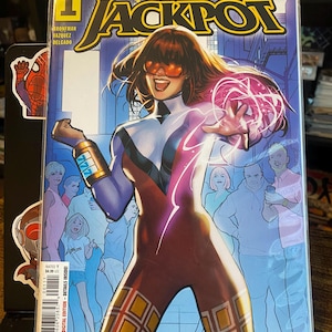 May include: A comic book cover featuring a female superhero with red hair and a red and white costume. The cover is titled "Gang War Jackpot" and features the number "1" in a circle. The comic book is published by Marvel.
