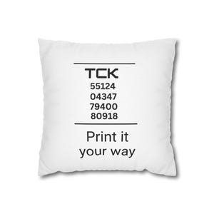 May include: White cushion with black text that reads "TCK 55124 04347 79400 80918 Print it your way".