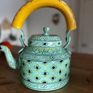 May include: A rustic wooden sign with the text "Welcome to our home" in white lettering. The sign features a distressed finish and a simple, inviting design, perfect for front door decor.