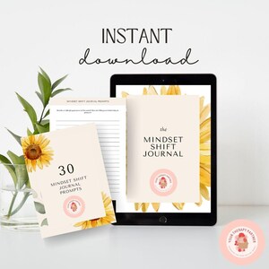 May include: A digital download of a printable journal with 30 mindset shift prompts. The journal cover features a watercolor illustration of sunflowers on a cream background. The text "the MINDSET SHIFT JOURNAL" is in black text. The journal is designed to help people improve their mental well-being.