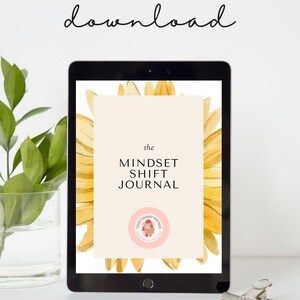 May include: A digital tablet displaying a digital download of "The Mindset Shift Journal" with a sunflower graphic and the text "Your Therapy Partner" in a pink circle.