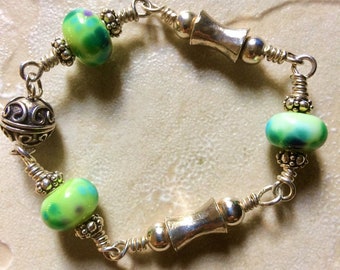 Green lampwork glass beaded bracelet with Bali silver beads.  Small size. OOAK bracelet with Thai silver and a magnetic clasp.  CLEARANCE