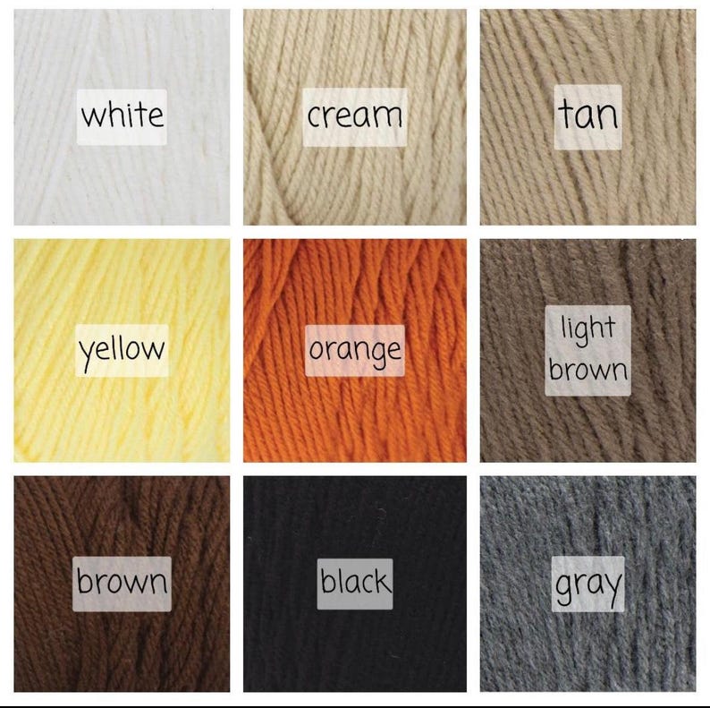 May include: A collection of yarn skeins in various colors, including white, cream, tan, yellow, orange, light brown, brown, black, and gray.