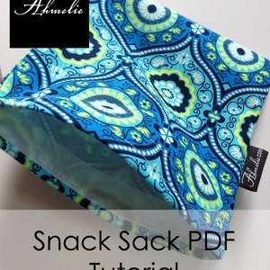 May include: A blue and green fabric snack sack with a paisley pattern. The sack is folded and the text "Snack Sack PDF Tutorial" is visible below.