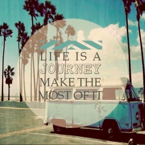 May include: A vintage blue and white van with the text "Life is a Journey Make the Most of It" in a circle with a blue and white striped design. The van is parked in front of a row of palm trees.