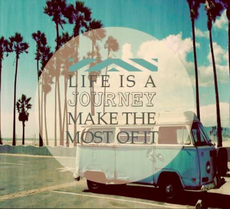May include: A vintage blue and white van with the text "Life is a Journey Make the Most of It" in a circle with a blue and white striped design. The van is parked in front of a row of palm trees.