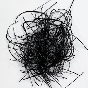May include: A pile of black, thin, flexible, and tangled plastic strips.